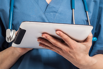 Nurse holding a tablet
